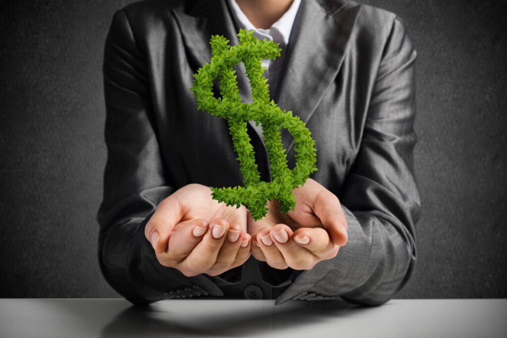 Business woman holding a bonsai tree shaped like a green dollar bill, symbolizing growth and strategic management of business debt for Canadian companies.
