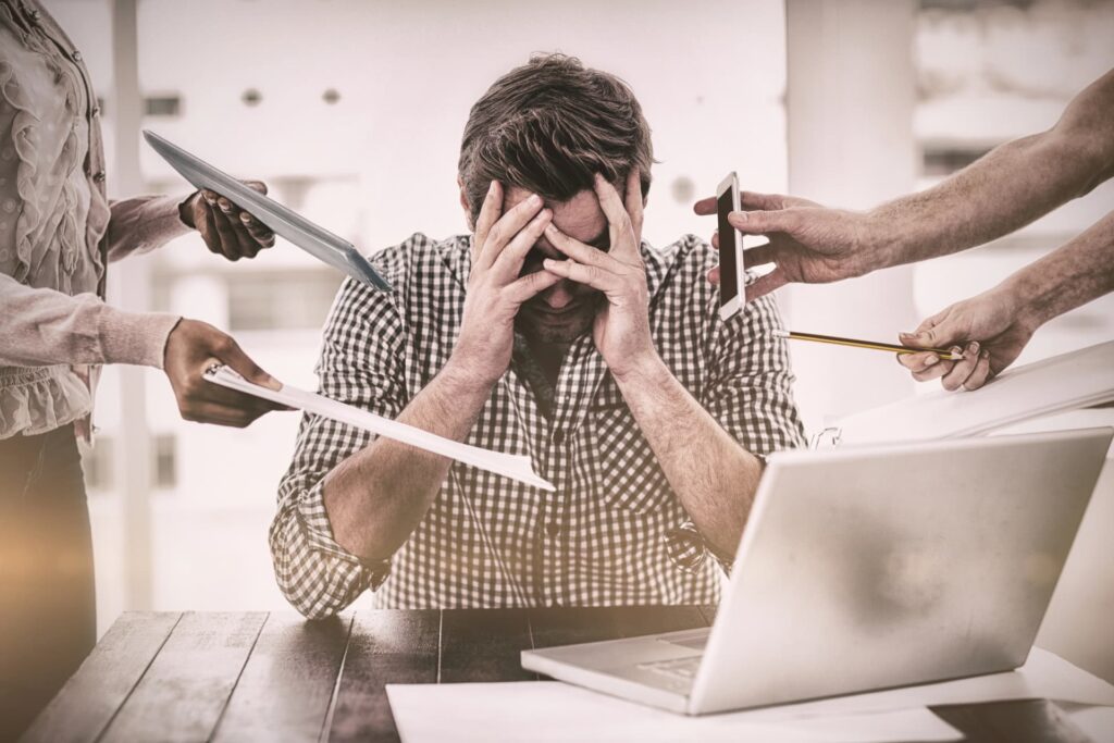 Canadian business owner stressed at work due to CRA garnishments and bank account freezes