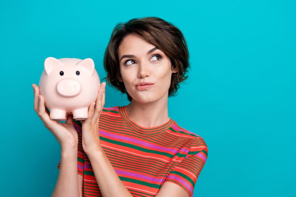 Woman with piggy bank representing debt relief solutions with a licensed insolvency trustee LIT in Canada